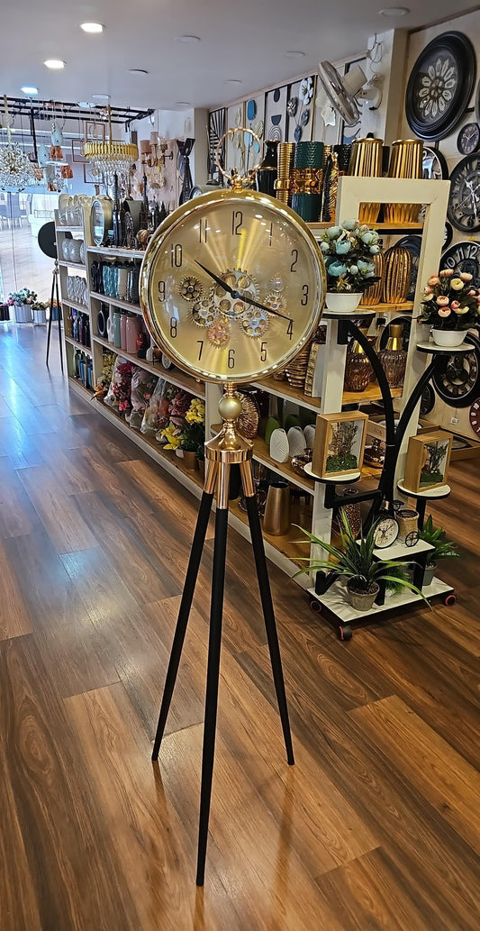 Golden Tripod Base Luxury Designer Clock With Moving Gear Mechanism